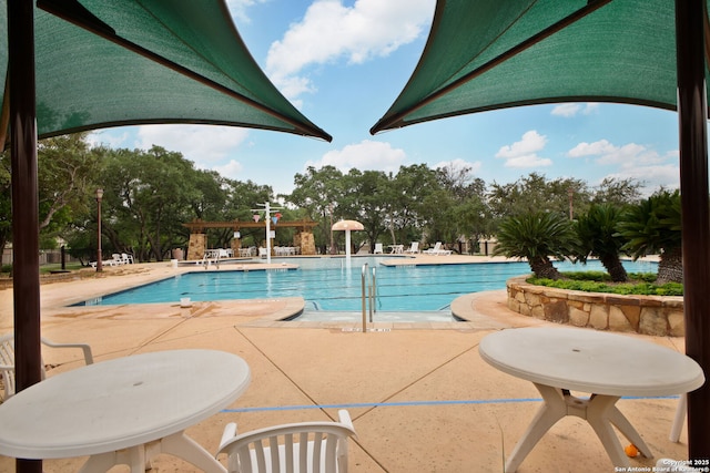 community pool featuring a patio