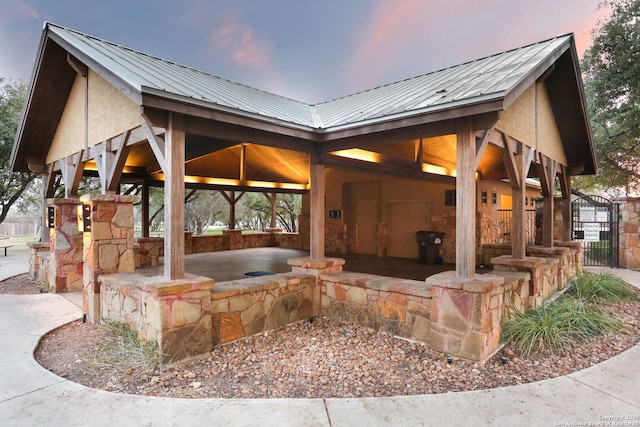 surrounding community with fence, a gate, and a gazebo