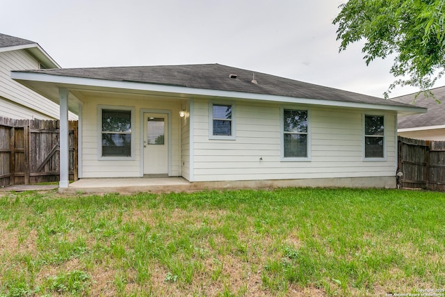 5735 Cardinal Fls, San Antonio, TX 78239 - back of property with a lawn, a fenced backyard, and a patio