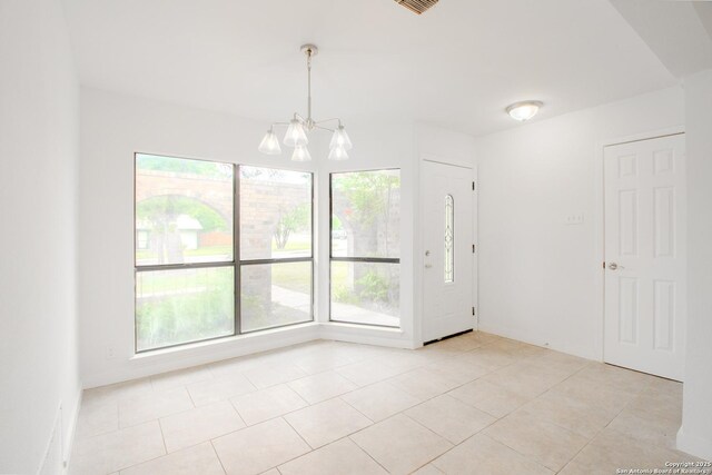 4742 Misty Run, San Antonio, TX 78217 - unfurnished dining area with light tile patterned flooring and a chandelier