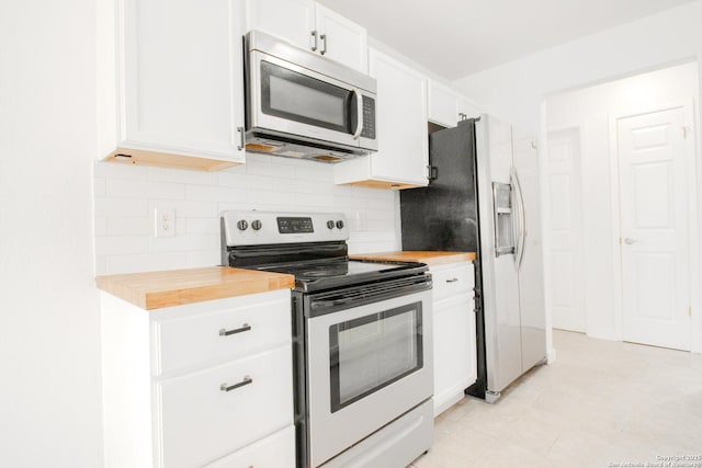 4742 Misty Run, San Antonio, TX 78217 - kitchen featuring backsplash, stainless steel appliances, white cabinets, and light tile patterned floors