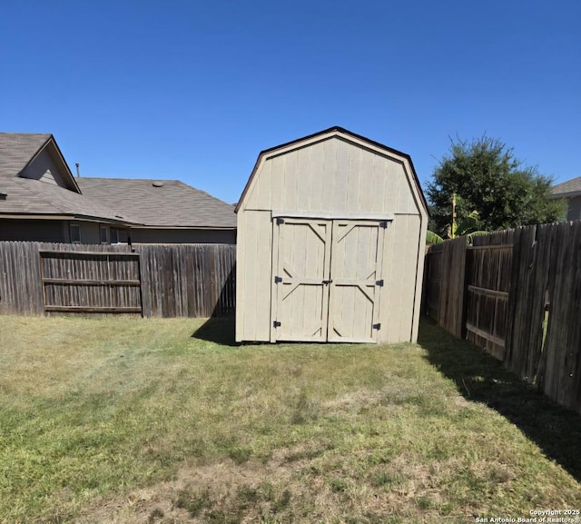 view of shed featuring a fenced backyard