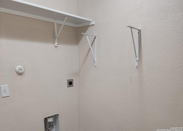 washroom featuring laundry area and electric dryer hookup