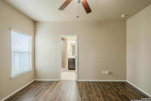 3830 Bogie Way, Converse, TX 78109 - spare room featuring baseboards, ceiling fan, and wood finished floors
