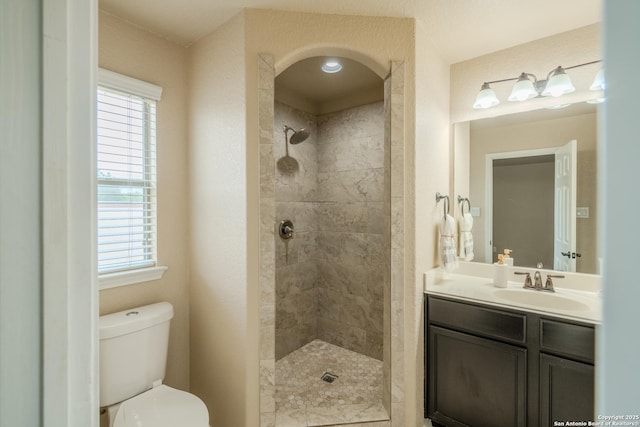 3830 Bogie Way, Converse, TX 78109 - bathroom with vanity, a wealth of natural light, toilet, and tiled shower