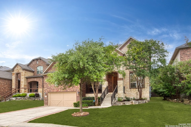 view of front of home featuring brick siding, a garage, a front lawn, and driveway