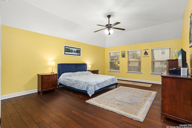 bedroom with baseboards, vaulted ceiling, and hardwood / wood-style floors