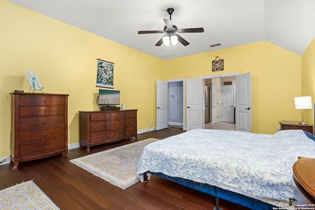 bedroom with a ceiling fan, visible vents, wood finished floors, baseboards, and lofted ceiling