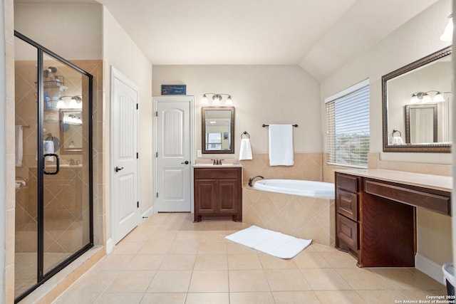 full bathroom featuring vanity, tile patterned floors, a shower stall, and a garden tub