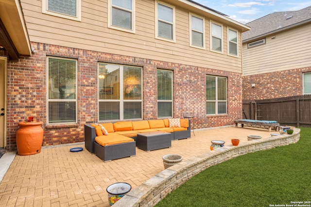 view of patio / terrace featuring an outdoor living space and fence