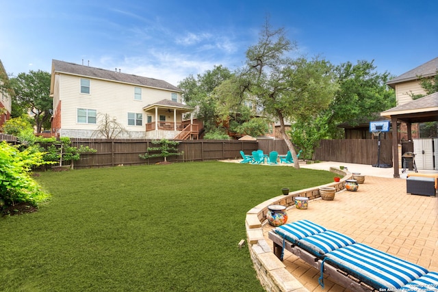 view of yard featuring a patio and a fenced backyard