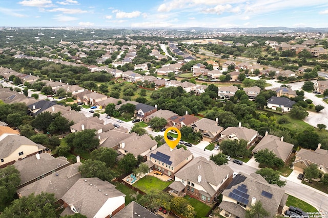 birds eye view of property with a residential view