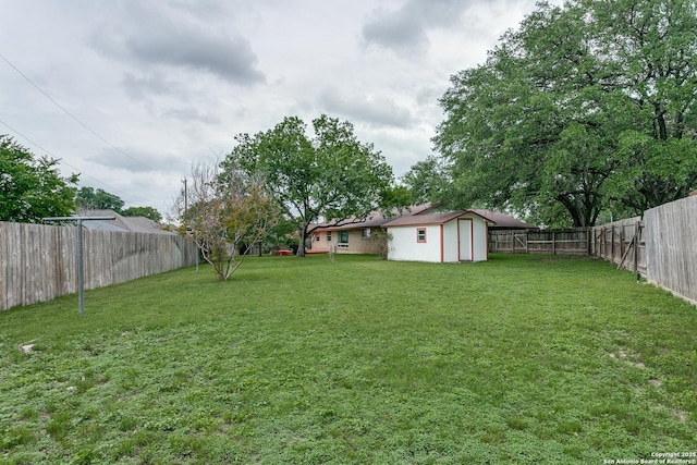 view of yard with an outbuilding and a shed