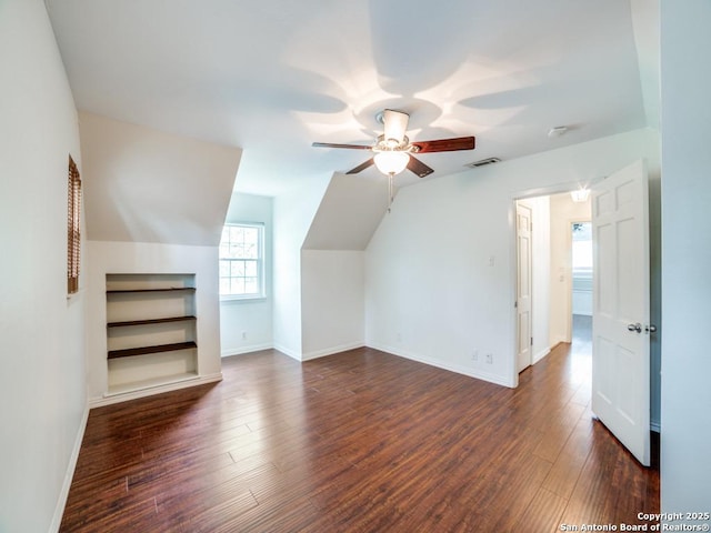 9327 Fernglen Dr, San Antonio, TX 78240 - additional living space with visible vents, baseboards, dark wood-type flooring, and ceiling fan