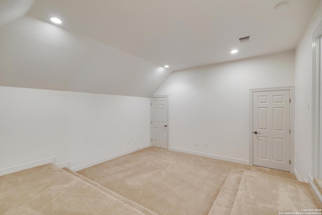 bonus room featuring visible vents, lofted ceiling, baseboards, recessed lighting, and light colored carpet