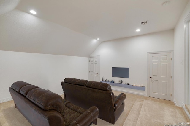 cinema room with visible vents, baseboards, recessed lighting, light colored carpet, and vaulted ceiling
