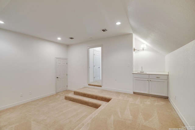 interior space with light colored carpet, baseboards, visible vents, and recessed lighting