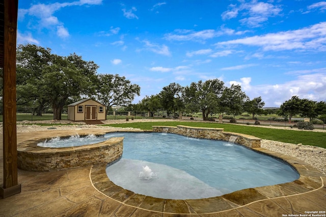 view of pool featuring a shed, a fenced in pool, an outbuilding, an in ground hot tub, and a yard