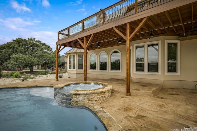 exterior space with ceiling fan, an in ground hot tub, a deck, a fenced in pool, and a patio