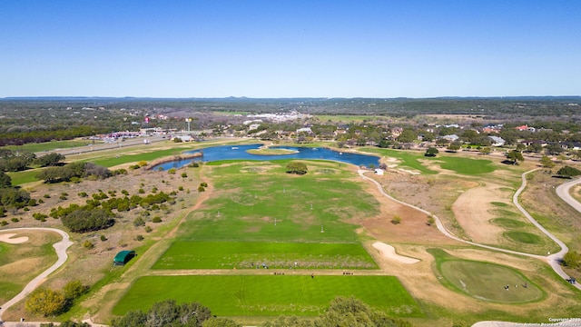 aerial view with a residential view, view of golf course, and a water view
