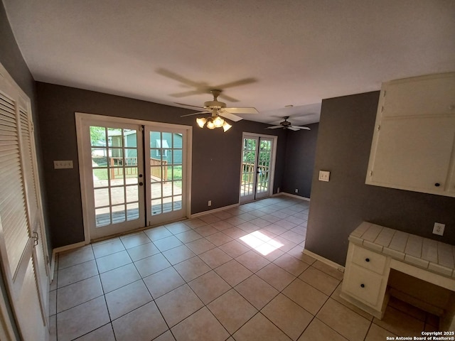 111 Blue Bonnet Blvd, Alamo Heights, TX 78209 - interior space featuring light tile patterned floors, baseboards, and a ceiling fan