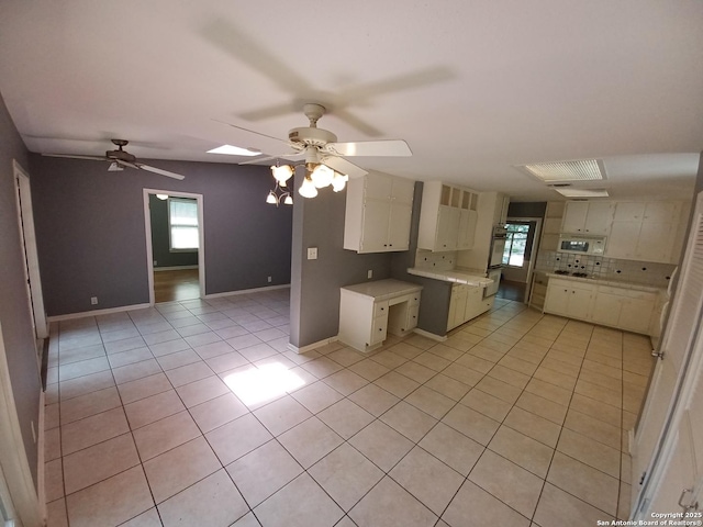 111 Blue Bonnet Blvd, Alamo Heights, TX 78209 - kitchen featuring white appliances, ceiling fan, and light tile patterned floors