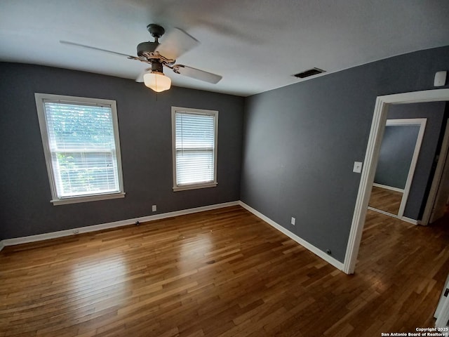 111 Blue Bonnet Blvd, Alamo Heights, TX 78209 - empty room with ceiling fan, visible vents, a healthy amount of sunlight, and wood finished floors