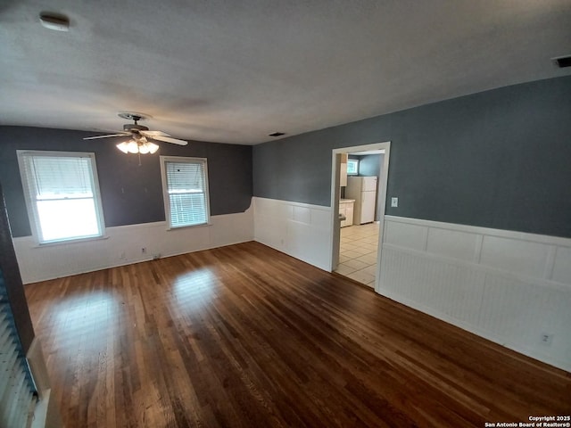 111 Blue Bonnet Blvd, Alamo Heights, TX 78209 - empty room with ceiling fan, visible vents, wainscoting, and wood finished floors