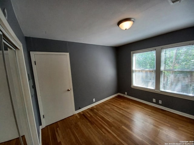 111 Blue Bonnet Blvd, Alamo Heights, TX 78209 - empty room featuring baseboards and wood finished floors
