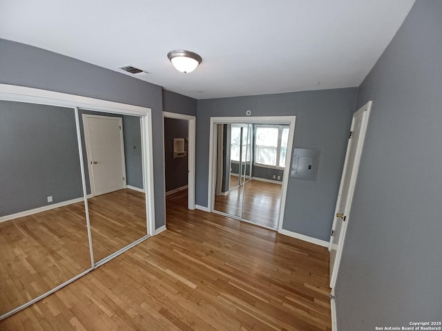 111 Blue Bonnet Blvd, Alamo Heights, TX 78209 - unfurnished bedroom with baseboards, wood finished floors, and visible vents