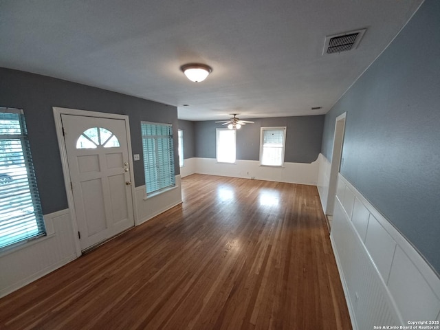 111 Blue Bonnet Blvd, Alamo Heights, TX 78209 - entrance foyer featuring ceiling fan, visible vents, wood finished floors, and a wainscoted wall