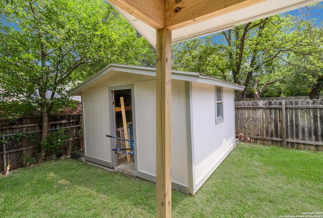 view of shed with a fenced backyard