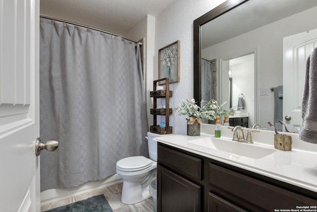 full bath featuring toilet and vanity