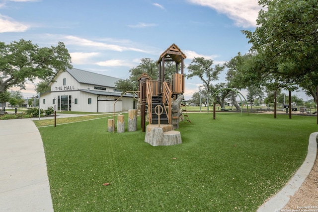 community play area featuring a lawn