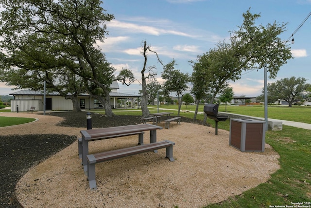 view of property's community with a lawn