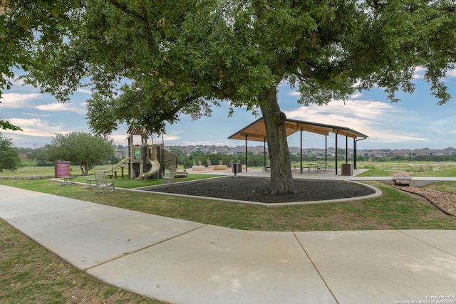 view of community with a yard and playground community
