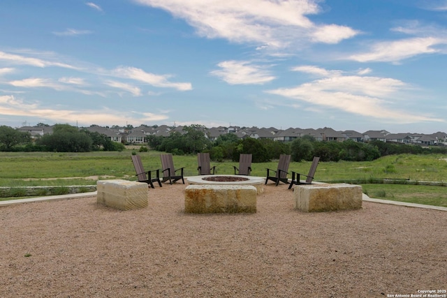 surrounding community featuring a residential view and an outdoor fire pit