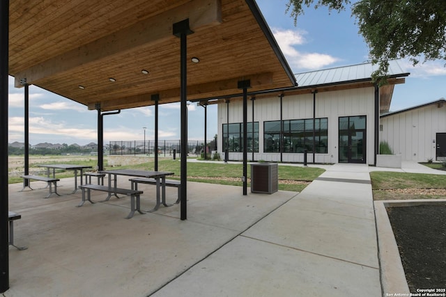 surrounding community with a lawn and a mountain view