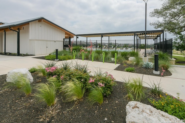 view of community featuring fence