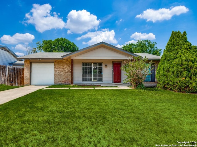 ranch-style home featuring fence, a front lawn, brick siding, a garage, and driveway