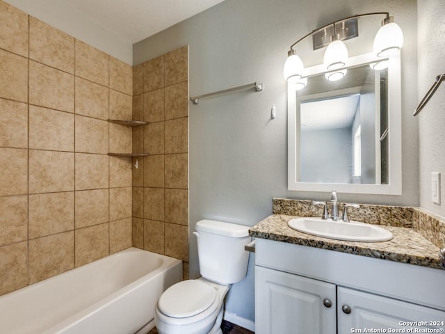bathroom featuring vanity, toilet, and tub / shower combination