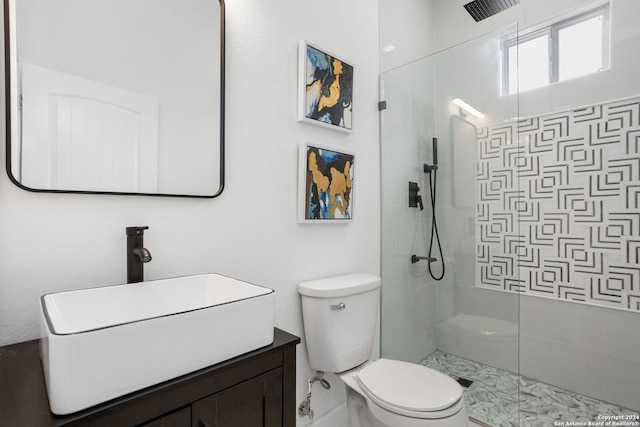 bathroom with a walk in shower, toilet, and vanity