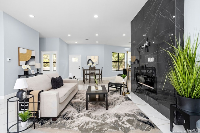 living room featuring baseboards, recessed lighting, and marble finish floor