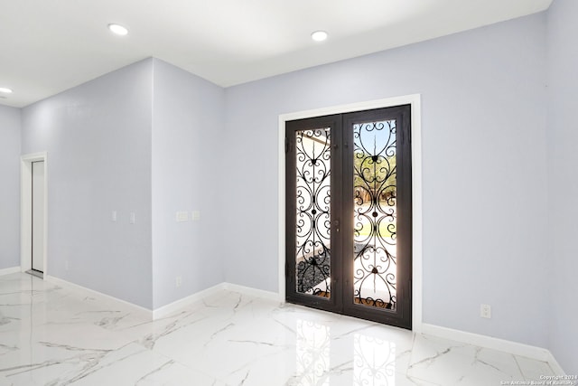 entryway with baseboards, french doors, and marble finish floor