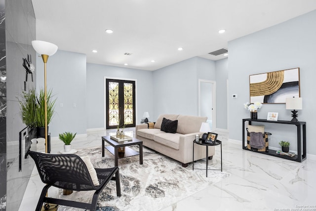 living room with visible vents, recessed lighting, and marble finish floor