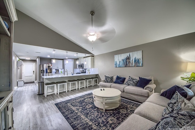 13408 Drop Seed, San Antonio, TX 78254 - living room featuring light wood-style flooring, ceiling fan, and high vaulted ceiling