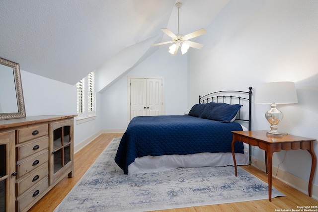 137A Spanish Pass, Boerne, TX 78006 - bedroom featuring vaulted ceiling, light wood finished floors, baseboards, ceiling fan, and a closet