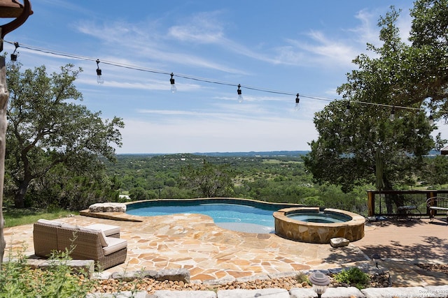 137A Spanish Pass, Boerne, TX 78006 - view of swimming pool with a view of trees, a pool with connected hot tub, and a deck