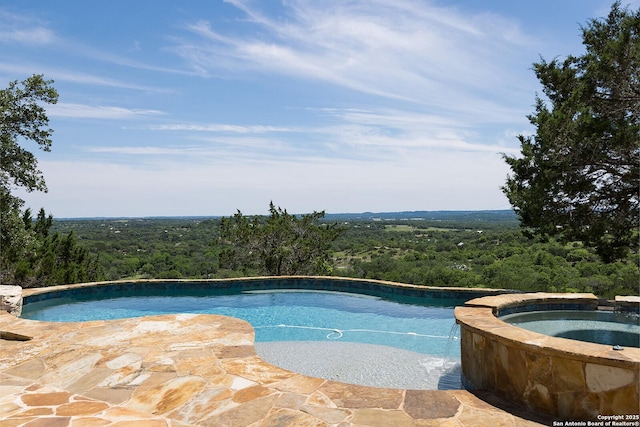 137A Spanish Pass, Boerne, TX 78006 - view of pool with a view of trees and a pool with connected hot tub