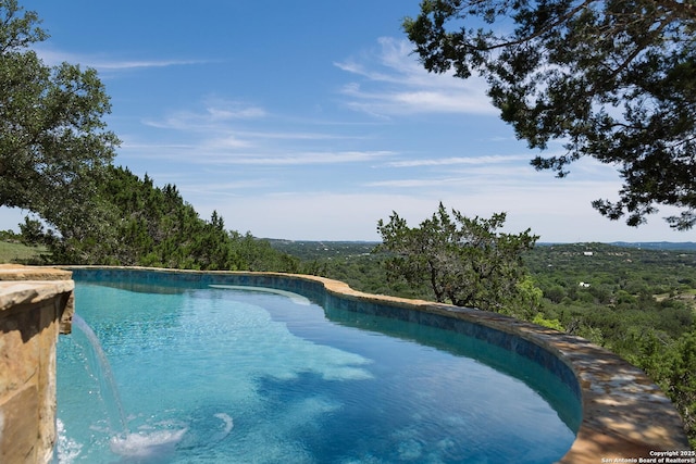 137A Spanish Pass, Boerne, TX 78006 - view of pool with a forest view and an infinity pool